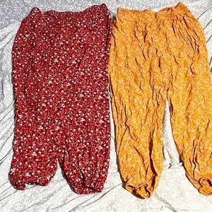 Red and yellow flowy pants with flower patterns